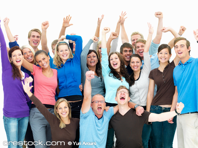 Group of people celebrating with raised hands.